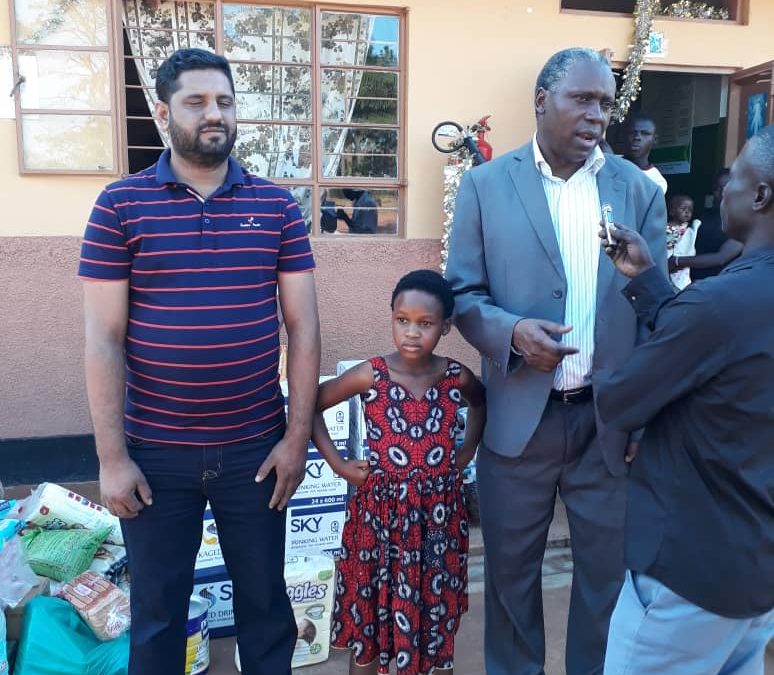 Ambassador Julius Peter Moto delivers Assortment of Items and Cash Donation to Lira Babies Home